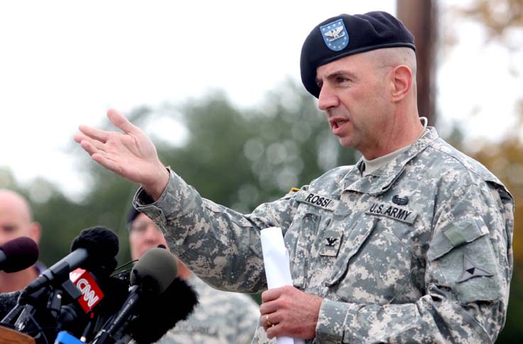 Col. John Rossi speaks during press conference